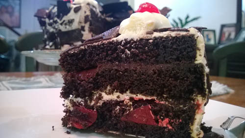 Black forest store cake red ribbon